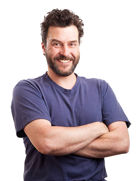 Portrait of bearded European man with arms crossed, smiling stock photo