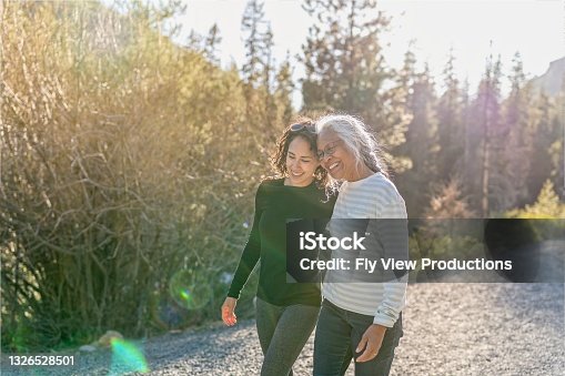 istock Portrait of beautiful mixed race senior woman spending time with her adult daughter outdoors 1326528501