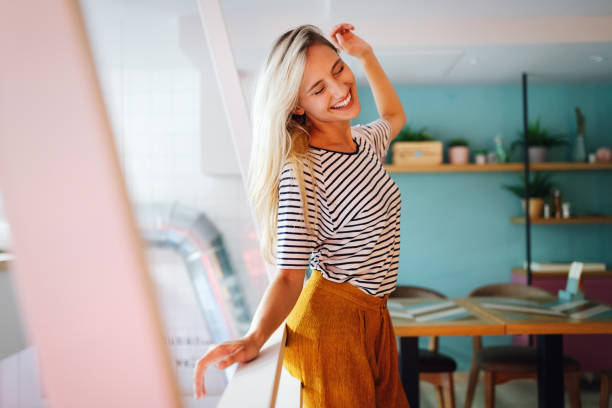 Portrait of beautiful young happy woman smiling and having fun stock photo