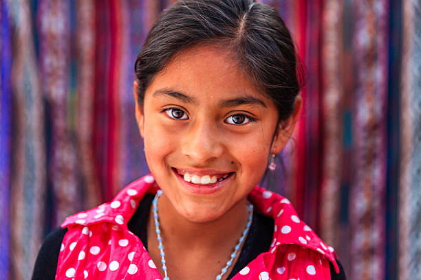 Portrait of beauty Peruvian girl in Pisac, The Sacred Valley The Sacred Valley of the Incas or Urubamba Valley is a valley in the Andes  of Peru, close to the Inca capital of Cusco and below the ancient sacred city of Machu Picchu. The valley is generally understood to include everything between Pisac  and Ollantaytambo, parallel to the Urubamba River, or Vilcanota River or Wilcamayu, as this Sacred river is called when passing through the valley. It is fed by numerous rivers which descend through adjoining valleys and gorges, and contains numerous archaeological remains and villages. The valley was appreciated by the Incas due to its special geographical and climatic qualities. It was one of the empire's main points for the extraction of natural wealth, and the best place for maize production in Peru.http://bem.2be.pl/IS/peru_380.jpg peru girl stock pictures, royalty-free photos & images