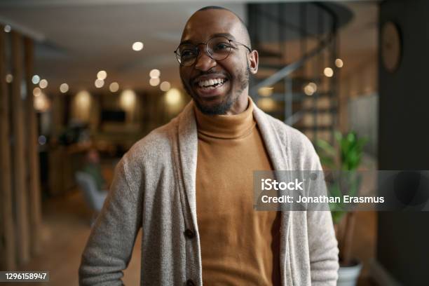 Portrait of creative trendy black african male designer laughing