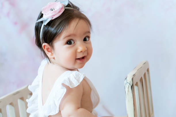Portrait of cute baby  in retro style indoors stock photo