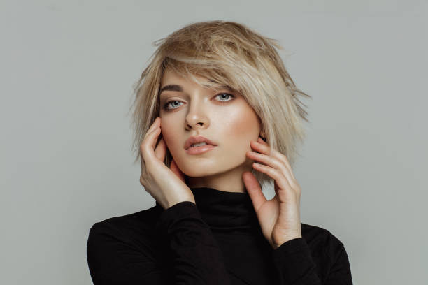 Portrait of fashion blond woman with short hair stock photo