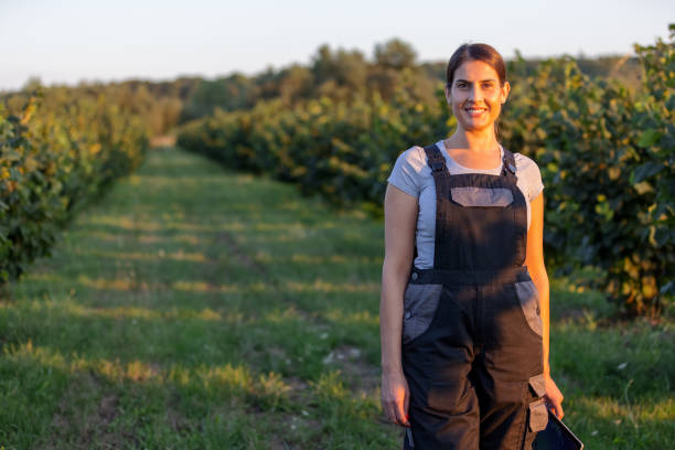 Portrait Of Female Agronomist In The Orchard stock photo