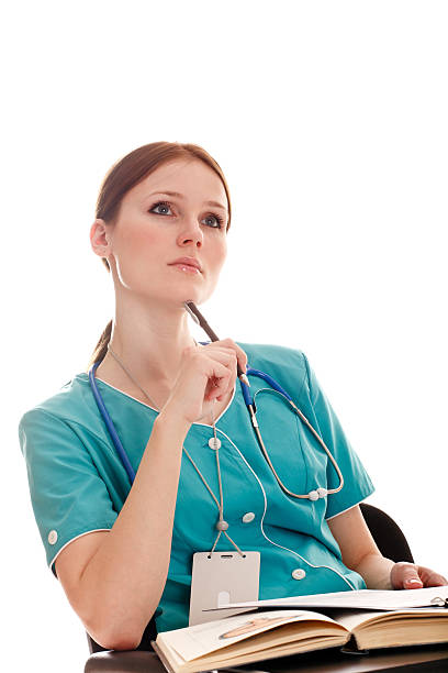 Portrait of female doctor in the green uniform stock photo