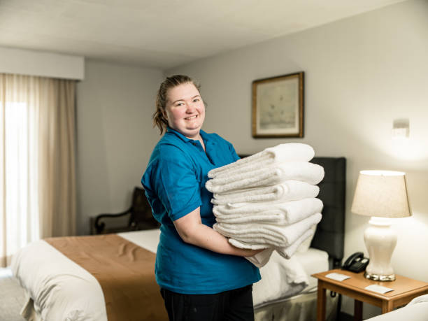 Portrait of female hotel housekeeper stock photo