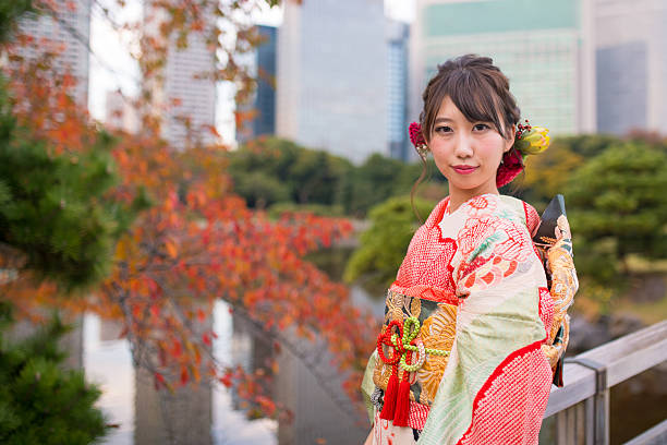 Portrait of Furisode girl in autumn garden Portrait of Furisode girl in autumn garden furisode stock pictures, royalty-free photos & images