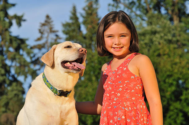 portrait of girl and pet dog stock photo