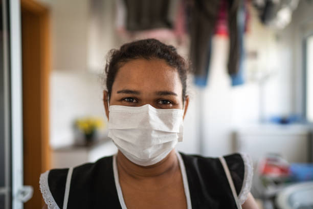 Portrait of housekeeper wearing protective mask at house Portrait of housekeeper wearing protective mask at house maid stock pictures, royalty-free photos & images