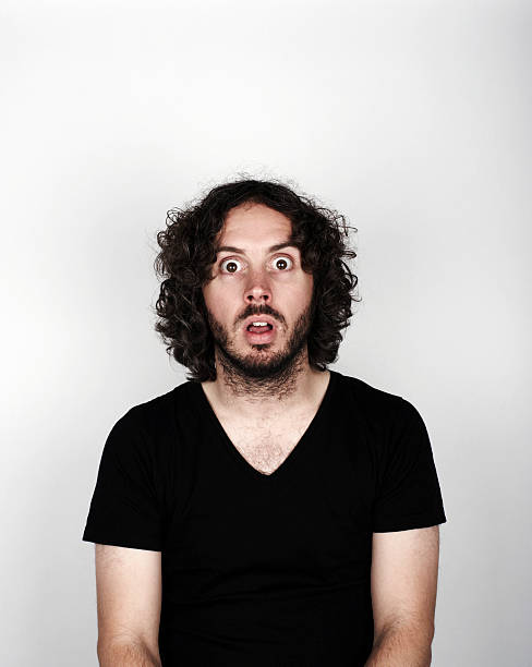 Portrait of man looking surprised  staring stock pictures, royalty-free photos & images