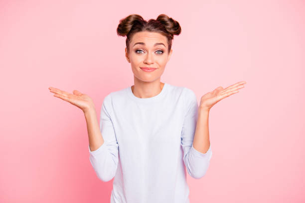 Portrait of nice-looking cute attractive winsome lovely funny cheerful cheery girl showing I don't know why what who when no idea gesture isolated over pink pastel background  ignorance stock pictures, royalty-free photos & images