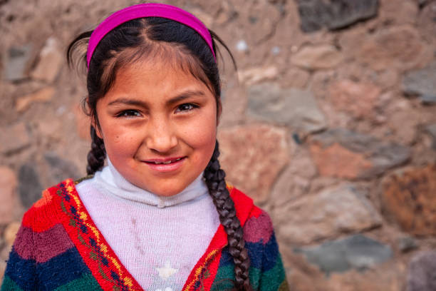 Portrait of Peruvian young girl near Chivay, Peru Chivay is a town in the Colca valley, capital of the Caylloma province in the Arequipa region, Peru. Located at about 12,000 ft above sea level, it lies upstream of the renowned Colca Canyon. It has a central town square and an active market. Ten kilometers to the east, and 1,500 meters above the town of Chivay lies the Chivay obsidian source. Thermal springs are located 3 km from town, a number of heated pools have been constructed. A stone "Inca" bridge crosses the Colca River ravine, just to the north of the town. The town is a popular staging point for tourists visiting Condor Cross or Cruz Del Condor, where condors can be seen catching thermal uplifts a few kilometers downstream. peru girl stock pictures, royalty-free photos & images