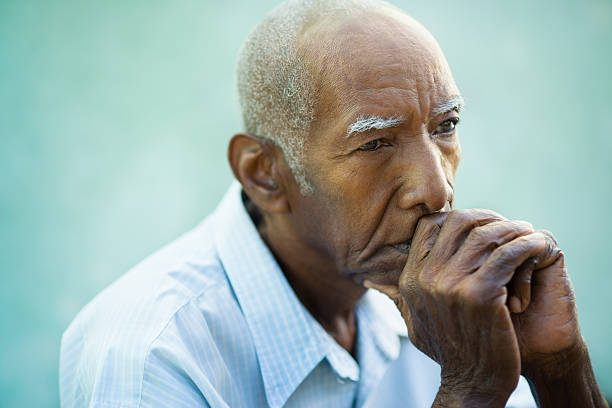 Portrait of sad bald senior man Seniors portrait of contemplative old african american man looking away. Copy space sad old black man stock pictures, royalty-free photos & images