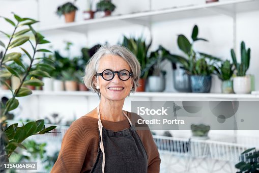 istock Portrait of senior female florist in her shop 1354064842