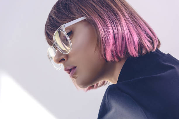 portrait of stylish girl with pink hair and glasses on white portrait of stylish girl with pink hair and glasses on white pink hair stock pictures, royalty-free photos & images