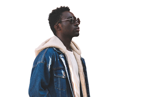 Portrait of stylish young african man model wearing denim jacket isolated on a white background