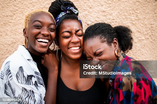 istock Portrait of three smiling women 1338095424