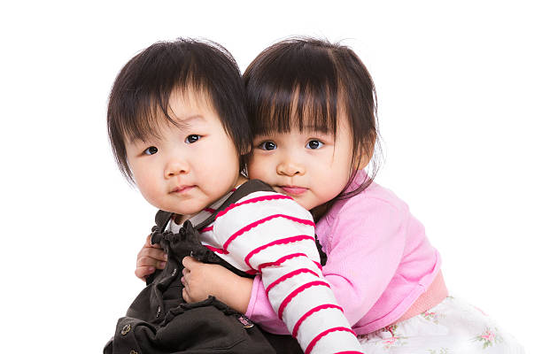 Portrait of two little Chinese girls stock photo