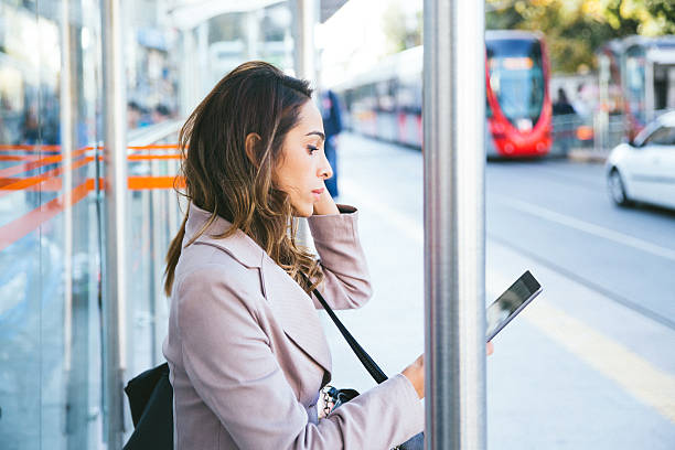 Portrait Of Two Young Women At The Tram Stop stock photo
