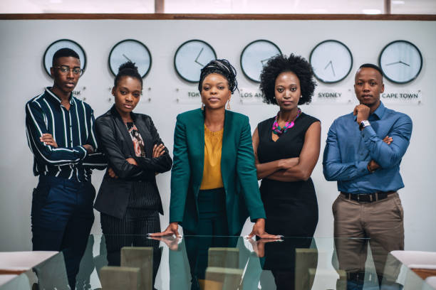 Portrait Of Young Business Team Portrait of young business team standing in the office. african ethnicity stock pictures, royalty-free photos & images