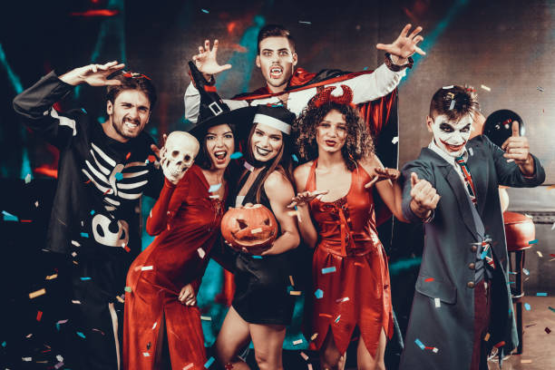 Portrait of Young Smiling People in Scary Costumes stock photo