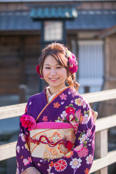 Portrait of young woman in furisode kimono for coming of age ceremony Portrait of young woman in furisode kimono for coming of age ceremony furisode stock pictures, royalty-free photos & images