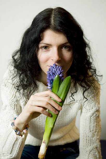 portrait of young woman with flower stock photo