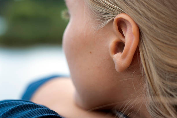 Portrait Focus on the ear human ear stock pictures, royalty-free photos & images