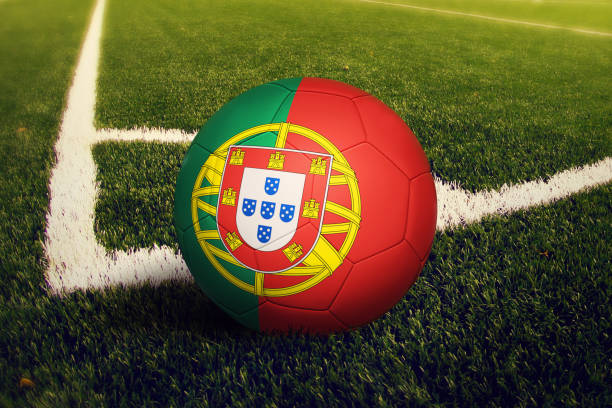 portugal ball on corner kick position, soccer field background. national football theme on green grass. - portugal flag stadium imagens e fotografias de stock
