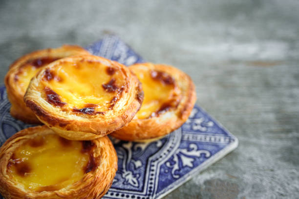 Portugal egg tart with azulejo Portugal egg tart Pastel de Nata with azulejo tile portugal stock pictures, royalty-free photos & images