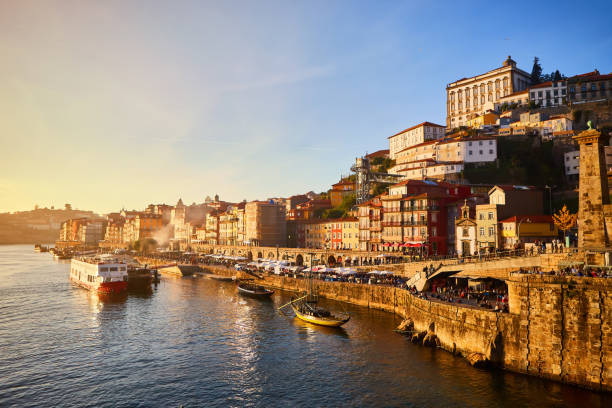 Portugal, Porto old town ribeira aerial promenade view with colorful houses, Douro river and boats.Concept of world travel, sightseeing and tourism stock photo