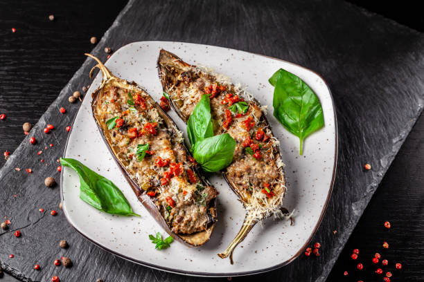 Portuguese cuisine. Baked eggplants with mushrooms, meat, vegetables and parmesan cheese. Copy space, selective focus stock photo