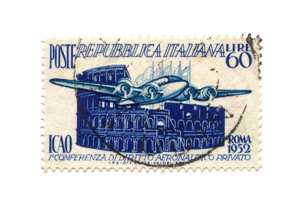 Postage stamp from Italy dated 1952 with airplane and colosseum stock photo