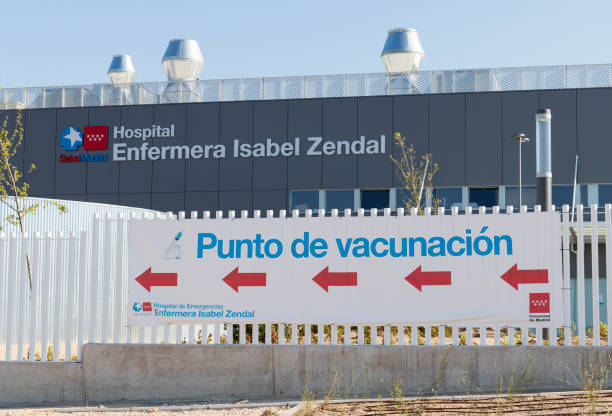 Poster indicating the COVID-19 vaccination point at the new pandemic hospital Nurse Isabel Zendal (Hospital Enfermera Isabel Zendal) Madrid, Spain; April 17 2021: Poster indicating the COVID-19 vaccination point at the new pandemic hospital Nurse Isabel Zendal (Hospital Enfermera Isabel Zendal) public service stock pictures, royalty-free photos & images