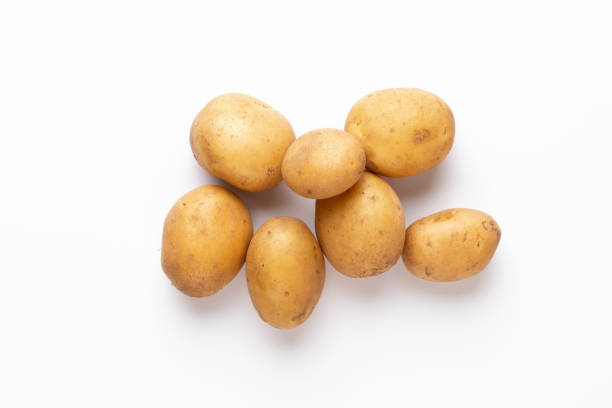 Potatoes isolated on white background. Flat lay. Top view. stock photo