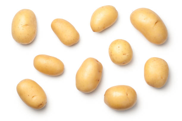 Potatoes Isolated on White Background Potatoes isolated on white background. Flat lay. Top view raw potato stock pictures, royalty-free photos & images