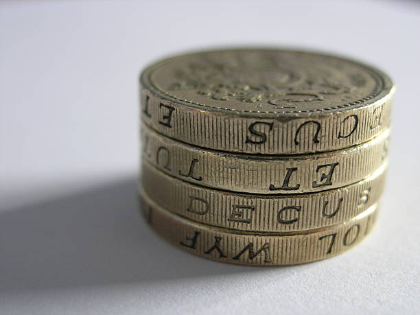 Pound Coins Macro shot English pound coins, skeable stock pictures, royalty-free photos & images