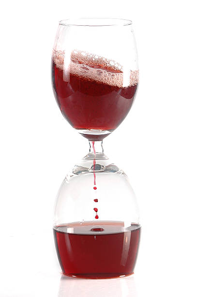 pour wine into glass stock photo