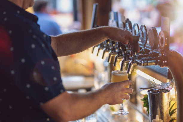 Pouring A Beer In A Rooftop Bar stock photo