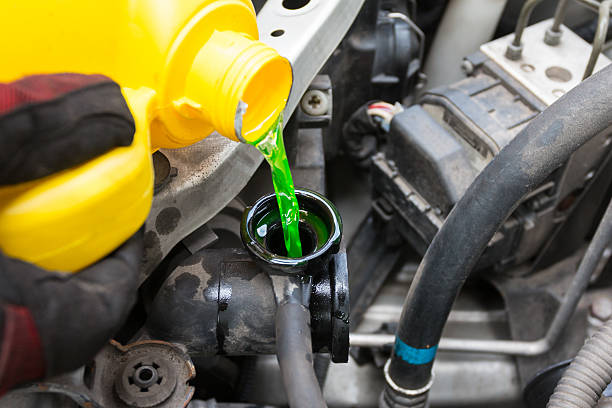 Pouring coolant Pouring coolant cycle vehicle stock pictures, royalty-free photos & images