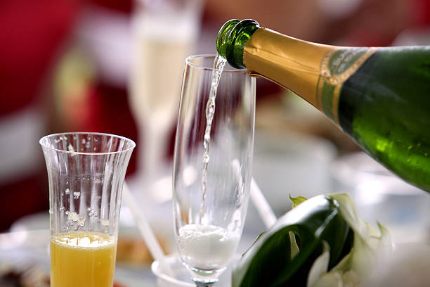 pouring sparkling wine stock photo