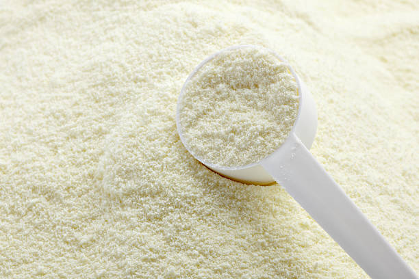 powdered milk dairy food for baby close up of powdered milk and spoon for baby on white background with clipping pathclose up of powdered milk and spoon for baby on white background with clipping path baby formula stock pictures, royalty-free photos & images