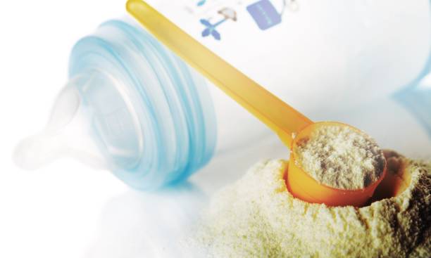 Powdered milk. Preparation of mixture baby feeding close up baby formula stock pictures, royalty-free photos & images