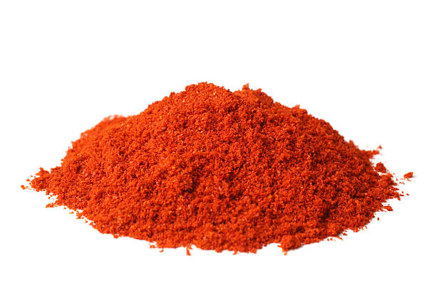 Powdered red pepper Powdered red pepper on white background cayenne pepper photos stock pictures, royalty-free photos & images