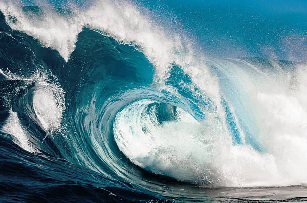 Power and Beauty Looking in to the eye of a huge blue wave. breaking wave photos stock pictures, royalty-free photos & images