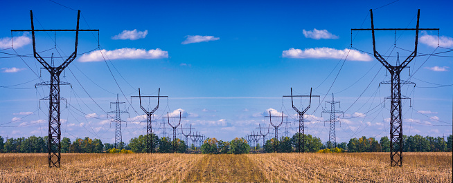 Power electrical lines against blue sky. Donbass region, Ukraine.