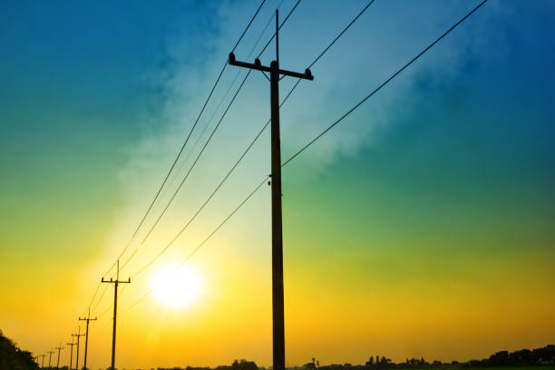 Power line pole Sunset power line pole in countryside electricity pylon stock pictures, royalty-free photos & images