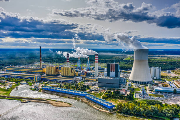 Power station under moody cloudy sky aerial view stock photo