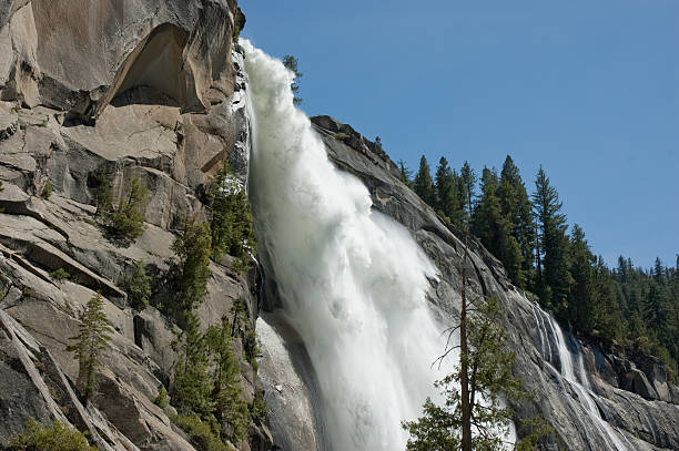Powerful Waterfall and Granite Cliff stock photo