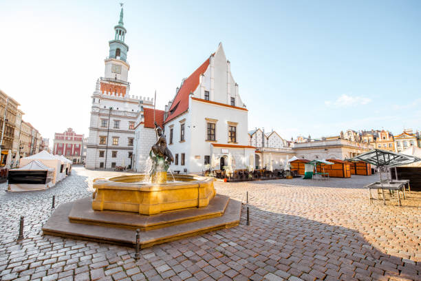 Poznan city in Krakow View on the Market square with Mars fountain and city hall during the morning light in Poznan in Poland poznan stock pictures, royalty-free photos & images